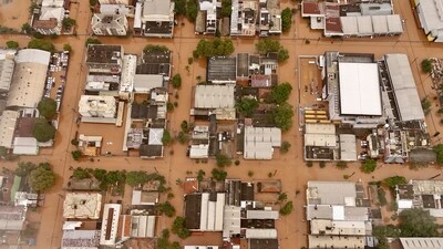 Aerial footage captures the inundated streets of the Navegantes neighbourhood in Porto Alegre, Rio Grande do Sul, Brazil, on Saturday. The severe flooding, a result of heavy rain in southern Brazil, has led to the death of at least 57 people and displaced nearly 70,000 individuals, according to the latest civil defence update. (AFP) Aerial footage captures the inundated streets of the Navegantes neighbourhood in Porto Alegre, Rio Grande do Sul, Brazil, on Saturday. The severe flooding, a result of heavy rain in southern Brazil, has led to the death of at least 57 people and displaced nearly 70,000 individuals, according to the latest civil defence update. (AFP)