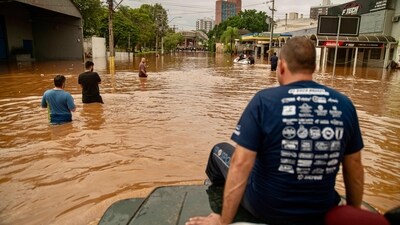 In Porto Alegre, Rio Grande do Sul, a volunteer team of off-road drivers assists in rescue efforts amid the floods on Saturday. With neighbourhoods submerged, authorities coordinate evacuations while rescue teams utilise four-wheel-drive vehicles and jet skis to navigate the waist-high waters, searching for those stranded. (AFP) In Porto Alegre, Rio Grande do Sul, a volunteer team of off-road drivers assists in rescue efforts amid the floods on Saturday. With neighbourhoods submerged, authorities coordinate evacuations while rescue teams utilise four-wheel-drive vehicles and jet skis to navigate the waist-high waters, searching for those stranded. (AFP)