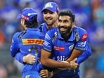 Mumbai Indians' Tim David hugs teammates Ishan Kishan and Jasprit Bumrah as they celebrate the dismissal of Sunrisers Hyderabad's Abhishek Sharma Mumbai Indians' Tim David hugs teammates Ishan Kishan and Jasprit Bumrah as they celebrate the dismissal of Sunrisers Hyderabad's Abhishek Sharma