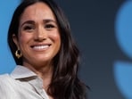 Meghan Markle scrambling after the launch of her forthcoming podcast was pushed back (Photo by SUZANNE CORDEIRO / AFP)