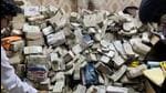 ED officials with the unaccounted cash in Ranchi. (ANI Photo)