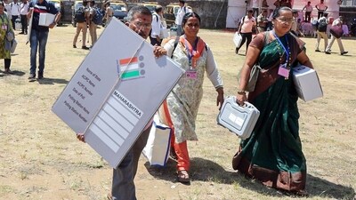 Polling officials leave a distribution center after collecting EVMs and other election material in Alibaug, Maharashtra. (ANI) Polling officials leave a distribution center after collecting EVMs and other election material in Alibaug, Maharashtra. (ANI)