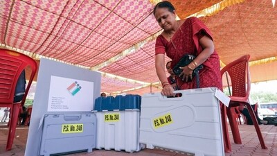 A polling official collects EVMs and other polling materials at the distribution center in Bellary, Karnataka. (ANI) A polling official collects EVMs and other polling materials at the distribution center in Bellary, Karnataka. (ANI)