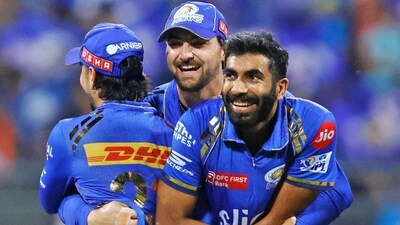 Mumbai Indians' Tim David hugs teammates Ishan Kishan and Jasprit Bumrah as they celebrate the dismissal of Sunrisers Hyderabad's Abhishek Sharma (MI-X) Mumbai Indians' Tim David hugs teammates Ishan Kishan and Jasprit Bumrah as they celebrate the dismissal of Sunrisers Hyderabad's Abhishek Sharma (MI-X)