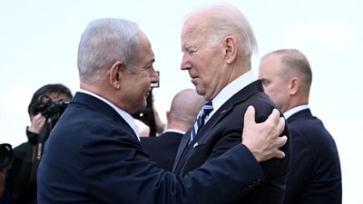 (FILES) Israel Prime Minister Benjamin Netanyahu (L) greets US President Joe Biden upon his arrival at Tel Aviv's Ben Gurion airport on October 18, 2023, amid the ongoing battles between Israel and the Palestinian group Hamas. Biden spoke by phone with Netanyahu April 4, 2024, the White House said, amid growing outrage over an Israeli strike that killed seven aid workers in Gaza. (Photo by Brendan SMIALOWSKI / AFP) (AFP) (FILES) Israel Prime Minister Benjamin Netanyahu (L) greets US President Joe Biden upon his arrival at Tel Aviv's Ben Gurion airport on October 18, 2023, amid the ongoing battles between Israel and the Palestinian group Hamas. Biden spoke by phone with Netanyahu April 4, 2024, the White House said, amid growing outrage over an Israeli strike that killed seven aid workers in Gaza. (Photo by Brendan SMIALOWSKI / AFP) (AFP)
