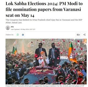 PM Modi greets supporters during a roadshow. PM Modi greets supporters during a roadshow.