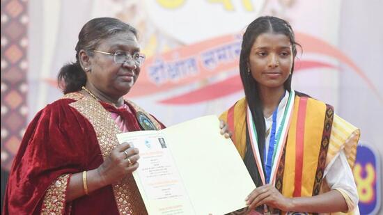 President Droupadi Murmu awarding the degree to a student during the Central University of Himachal Pradesh’s convocation in Dharamshala. (HT Photo)