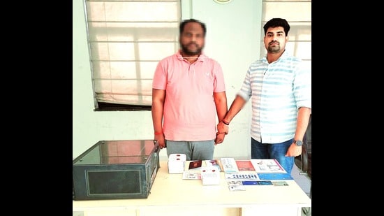 The accused in police custody in Lucknow on Monday (HT Photo)