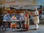 A polling official checks the name of a woman before allowing her to cast her vote during the third round of voting in the six-week-long general election in Agra on Tuesday. (AP)