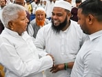 Patna: RJD chief Lalu Prasad Yadav being greeted by MLCs during their swearing-in ceremony, in Patna. (PTI)