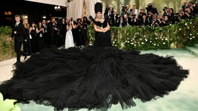 Cardi B made a striking appearance at the Met Gala in a voluminous black gown that commanded attention as it dominated the staircase. To complement her show-stopping look, she accessorised with dazzling diamond and emerald jewellery, including oversized earrings, a statement necklace and a bedazzled bracelet. She is definitely one of the best dressed celebs of the night. (Evan Agostini/Invision/AP) Cardi B made a striking appearance at the Met Gala in a voluminous black gown that commanded attention as it dominated the staircase. To complement her show-stopping look, she accessorised with dazzling diamond and emerald jewellery, including oversized earrings, a statement necklace and a bedazzled bracelet. She is definitely one of the best dressed celebs of the night. (Evan Agostini/Invision/AP)