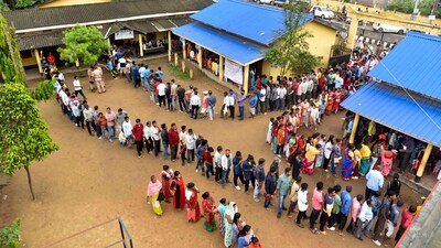 People wait in queues to cast their vote at a polling station in Guwahati, Assam. (PTI) People wait in queues to cast their vote at a polling station in Guwahati, Assam. (PTI)