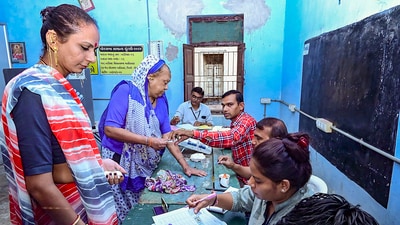 Members of the transgender community wait to cast their vote at a polling station in Kheda, Gujarat. (PTI) Members of the transgender community wait to cast their vote at a polling station in Kheda, Gujarat. (PTI)