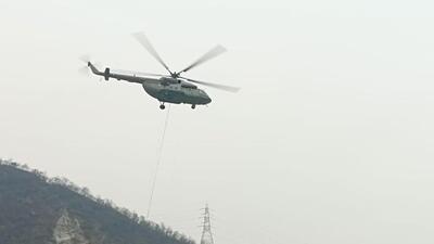 An Mi-17 IAF helicopter engaging in aerial firefighting operation in Uttarakhand’s Pauri Garhwal on Tuesday. An Mi-17 IAF helicopter engaging in aerial firefighting operation in Uttarakhand’s Pauri Garhwal on Tuesday.