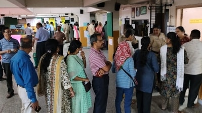 Voters line up at a polling station in Baramati Voters line up at a polling station in Baramati