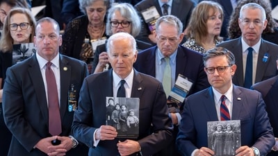 President Joe Biden, left, and Speaker of the House Mike Johnson, R-La., stand to honor the memory of the 6 million Jews killed in the Holocaust during the annual Days of Remembrance ceremony, at the Capitol in Washington, Tuesday, May 7, 2024. (AP Photo/J. Scott Applewhite) (AP) President Joe Biden, left, and Speaker of the House Mike Johnson, R-La., stand to honor the memory of the 6 million Jews killed in the Holocaust during the annual Days of Remembrance ceremony, at the Capitol in Washington, Tuesday, May 7, 2024. (AP Photo/J. Scott Applewhite) (AP)