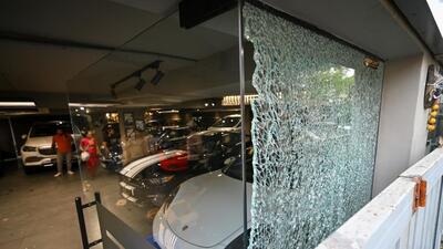 Bullet marks and broken glass at the showroom in Ganesh Nagar, west Delhi. (Sanchit Khanna/HT) Bullet marks and broken glass at the showroom in Ganesh Nagar, west Delhi. (Sanchit Khanna/HT)