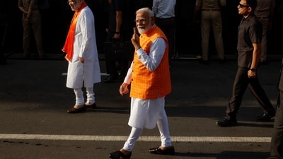 PM Narendra Modi reached the polling booth at Nishan Public School in Ranip locality of Ahmedabad city soon after the polling began at 7 am and cast his vote.&nbsp; (REUTERS)