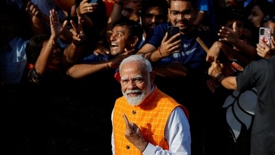 Union minister and senior BJP leader Amit Shah, who is contesting to retain the Gandhinagar Lok Sabha seat, was present when PM Narendra Modi reached the polling booth.&nbsp; (REUTERS)