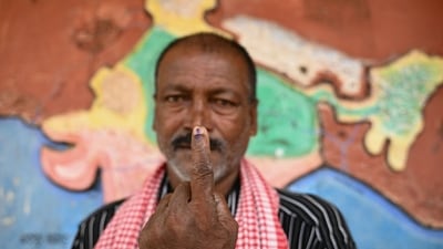 Manusha, a voter from the Hakki Pikki tribal community displays his inked finger after casting his ballot at a polling station during the third phase of voting for the India's general election, at Sadashivapura village of Shimoga district in Karnataka, on May 7, 2024. (AFP) Manusha, a voter from the Hakki Pikki tribal community displays his inked finger after casting his ballot at a polling station during the third phase of voting for the India's general election, at Sadashivapura village of Shimoga district in Karnataka, on May 7, 2024. (AFP)