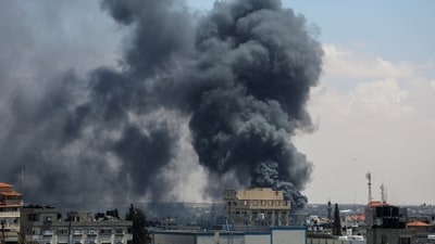 Smoke rises after an Israeli strike as Israeli forces launch a ground and air operation in the eastern part of Rafah. (Reuters)