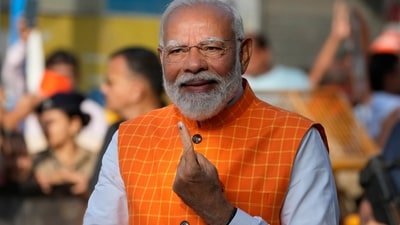 PM Narendra Modi, shows the indelible ink mark on his index finger after casting his vote during the third phase of general elections, in Ahmedabad, Gujarat. (AP) PM Narendra Modi, shows the indelible ink mark on his index finger after casting his vote during the third phase of general elections, in Ahmedabad, Gujarat. (AP)