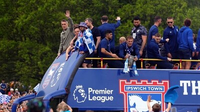 Ipswich Town manager Kieran McKenna and players wave to the fans from the parade bus as they celebrate promotion to Premier League. (Action Images via Reuters)