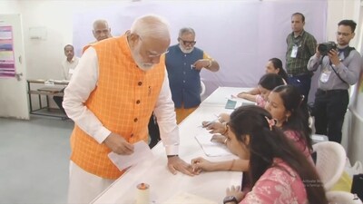 PM Narendra Modi goes through the election procedure to cast his vote for the third phase of Lok Sabha elections in Ahmedabad. (PTI) PM Narendra Modi goes through the election procedure to cast his vote for the third phase of Lok Sabha elections in Ahmedabad. (PTI)
