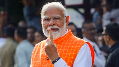 Ahmedabad: Prime Minister Narendra Modi shows his ink-marked finger after casting his vote for the third phase of Lok Sabha elections, in Ahmedabad, Tuesday, May 7, 2024. (PTI Photo) (PTI05_07_2024_000042B) (PTI) Ahmedabad: Prime Minister Narendra Modi shows his ink-marked finger after casting his vote for the third phase of Lok Sabha elections, in Ahmedabad, Tuesday, May 7, 2024. (PTI Photo) (PTI05_07_2024_000042B) (PTI)