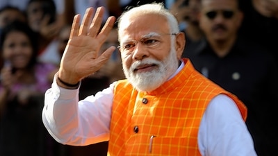 Prime Minister Narendra Modi arrives to cast his vote for the third phase of Lok Sabha elections in Ahmedabad on Tuesday, May 7, (PTI)