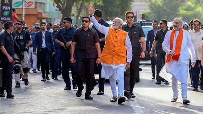While PM Narendra Modi cast his vote at a polling booth in Gandhinagar Lok Sabha constituency, Amit Shah cast his vote at a polling booth in Ahmedabad. (PTI) While PM Narendra Modi cast his vote at a polling booth in Gandhinagar Lok Sabha constituency, Amit Shah cast his vote at a polling booth in Ahmedabad. (PTI)