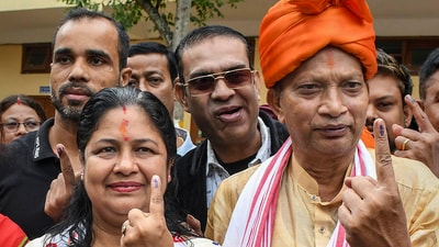 BJP candidate Bijuli Kalita Medhi with her husband shows her finger marked with indelible ink after casting votes at a polling station during the third phase of Lok Sabha polls, in Guwahati. (PTI) BJP candidate Bijuli Kalita Medhi with her husband shows her finger marked with indelible ink after casting votes at a polling station during the third phase of Lok Sabha polls, in Guwahati. (PTI)