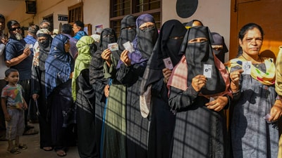 People wait in queues to cast their votes at a polling station during the 3rd phase of Lok Sabha polls, in Karnataka on Tuesday. (PTI) People wait in queues to cast their votes at a polling station during the 3rd phase of Lok Sabha polls, in Karnataka on Tuesday. (PTI)