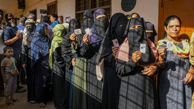 People wait in queues to cast their votes at a polling station during the 3rd phase of Lok Sabha polls, in Karnataka, Tuesday. (PTI) People wait in queues to cast their votes at a polling station during the 3rd phase of Lok Sabha polls, in Karnataka, Tuesday. (PTI)