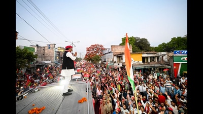 Samajwadi Party (SP) chief Akhilesh Yadav greets the crowd during a roadshow for the Lok Sabha polls, in Kannauj on Monday. (Akhilesh Yadav-X)