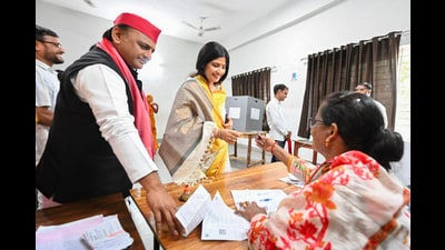 Samajwadi Party chief Akhilesh Yadav and his wife and party candidate from Mainpuri Dimple Yadav get their fingers inked before casting their votes in Saifai of Etawah district on Tuesday. (PTI) Samajwadi Party chief Akhilesh Yadav and his wife and party candidate from Mainpuri Dimple Yadav get their fingers inked before casting their votes in Saifai of Etawah district on Tuesday. (PTI)