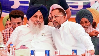 Shiromani Akali Dal chief Sukhbir Singh Badal with party candidate Anil Joshi during a rally on the outskrits of Amritsar. (PTI)