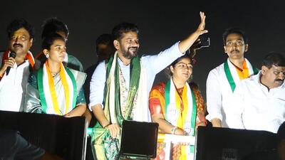 Telangana chief minister Revanth Reddy waves to the supporters during a roadshow for the Lok Sabha polls at Uppal in Hyderabad on Monday. (ANI) Telangana chief minister Revanth Reddy waves to the supporters during a roadshow for the Lok Sabha polls at Uppal in Hyderabad on Monday. (ANI)