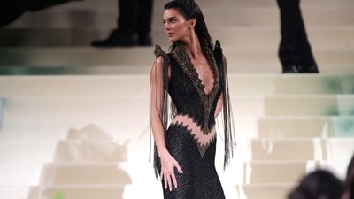 Kendall Jenner turned heads at the Met Gala in a never-before-worn Givenchy dress. The supermodel flaunted a cheeky Givenchy Haute Couture 1999 ensemble, featuring a sheer cutout that offered a daring glimpse of her backside, making a bold statement.&nbsp; (REUTERS)