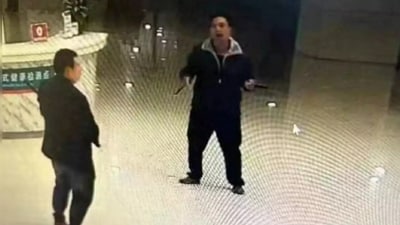 Man in CCTV footage seen holding knife in hospital lobby (Image published by The Paper)