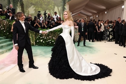 Nicole Kidman and Keith Urban pose at the Met Gala carpet in matching black and white ensembles. (REUTERS)
