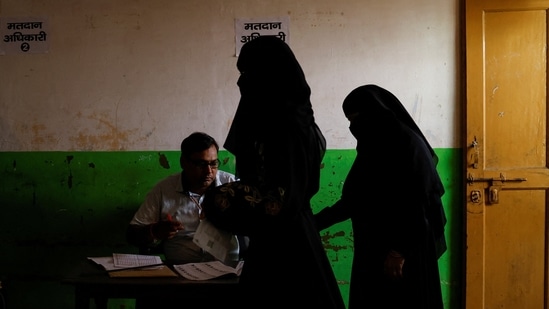 Women vote at a polling station at Sambhal district in Uttar Pradesh.(Reuters)