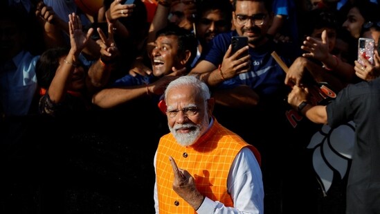 Union minister and senior BJP leader Amit Shah, who is contesting to retain the Gandhinagar Lok Sabha seat, was present when PM Narendra Modi reached the polling booth.&nbsp;(REUTERS)