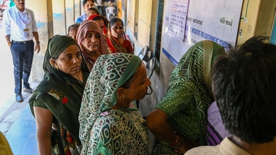 Voters queue at a polling station during the third phase of voting for national elections in Ahmedabad on May 7. Voters queue at a polling station during the third phase of voting for national elections in Ahmedabad on May 7.