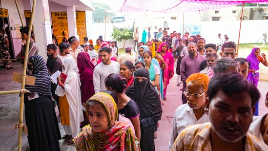 People wait to cast their vote for the third phase of Lok Sabha elections, in Bareilly.(PTI)