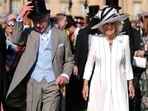 King Charles III and Queen Camilla attending a Royal Garden Party at Buckingham Palace, London. Picture date: Wednesday May 8, 2024. PA Photo. See PA story ROYAL Garden. Photo credit should read: Jordan Pettitt/PA Wire    Jordan Pettitt/Pool via REUTERS