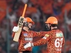 Sunrisers Hyderabad's openers Travis Head and Abhishek Sharma celebrate the team's victory against Lucknow Super Giants 