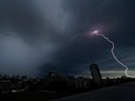 Lightning strikes in the distance as a thunderstorm passes over downtown Kansas City, Mo., July 30, 2023. Tens of millions of Americans stretching from Lincoln, Neb., to Baltimore could face strong thunderstorms Monday night, April 15, 2024, through Wednesday, April 17, with tornadoes possible in some states. (AP Photo/Charlie Riedel, File) Lightning strikes in the distance as a thunderstorm passes over downtown Kansas City, Mo., July 30, 2023. Tens of millions of Americans stretching from Lincoln, Neb., to Baltimore could face strong thunderstorms Monday night, April 15, 2024, through Wednesday, April 17, with tornadoes possible in some states. (AP Photo/Charlie Riedel, File)