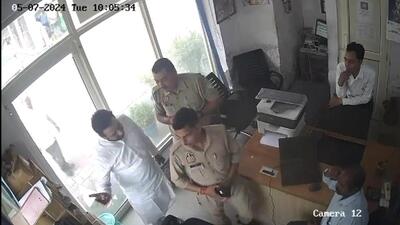 A purported video clip of MLA Khan (in white) talking to the fuel station staff in the presence of two policemen on Tuesday. (HT Photo) A purported video clip of MLA Khan (in white) talking to the fuel station staff in the presence of two policemen on Tuesday. (HT Photo)