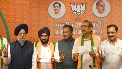Arvinder Singh Lovely and Raj Kumar Chauhan joined the BJP from the Congress on May 4. (HT File Photo)